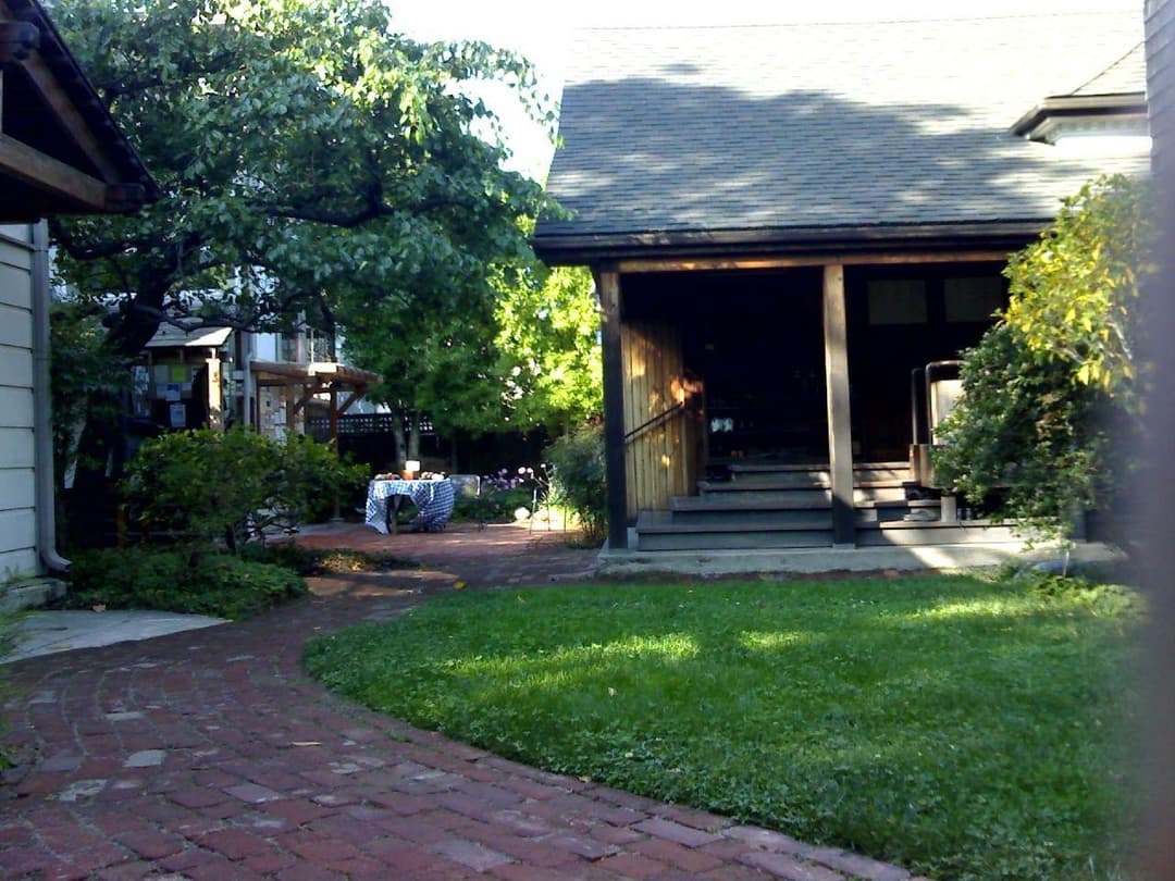 Courtyard garden and zendo entrance with brick pathway