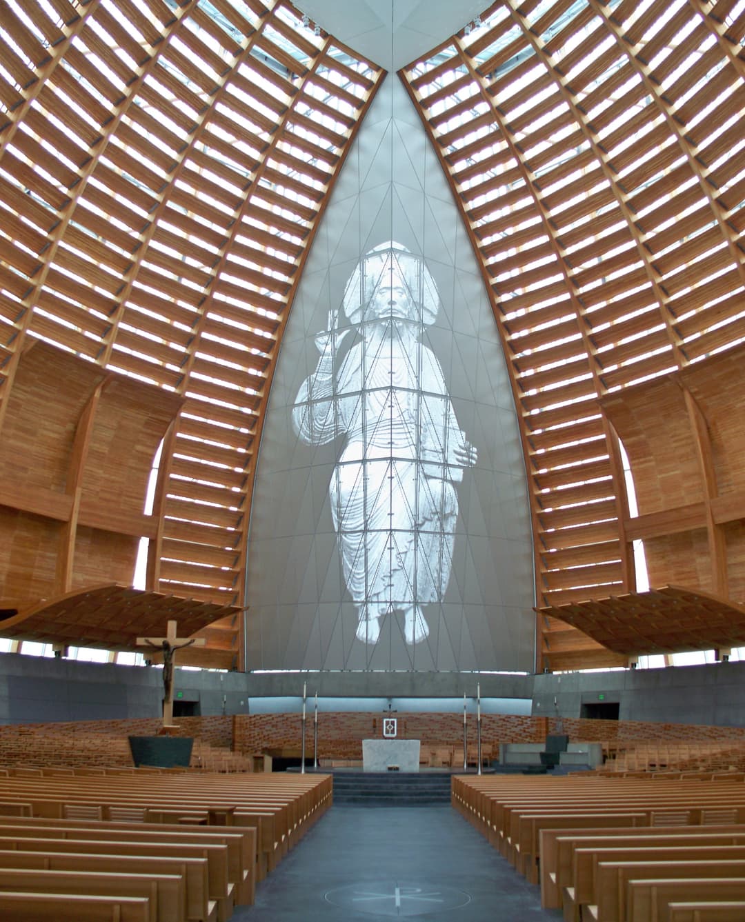 Interior view of the sanctuary facing the altar and Christ image.