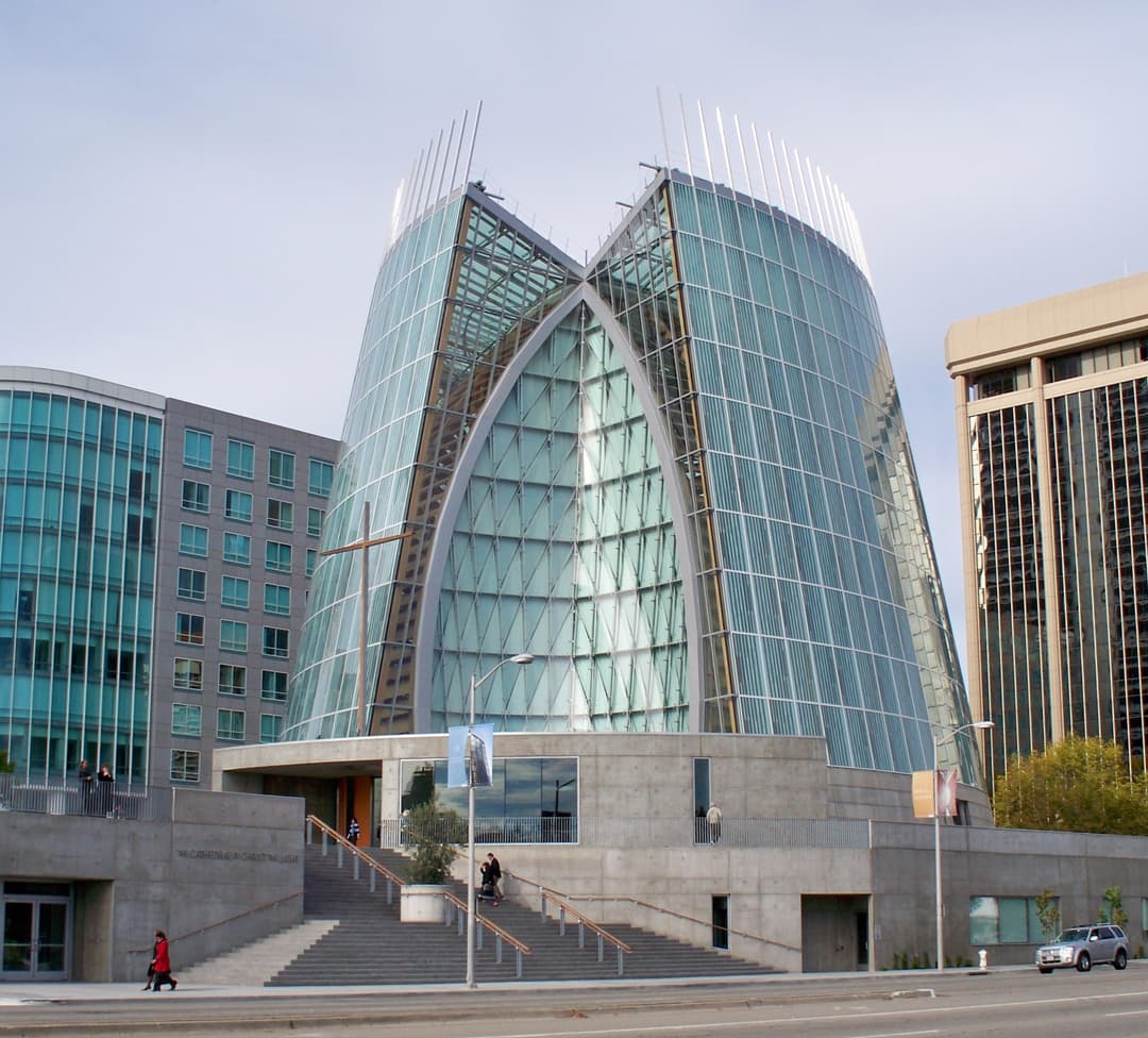 Exterior view of the front entrance and glass facade in daylight.
