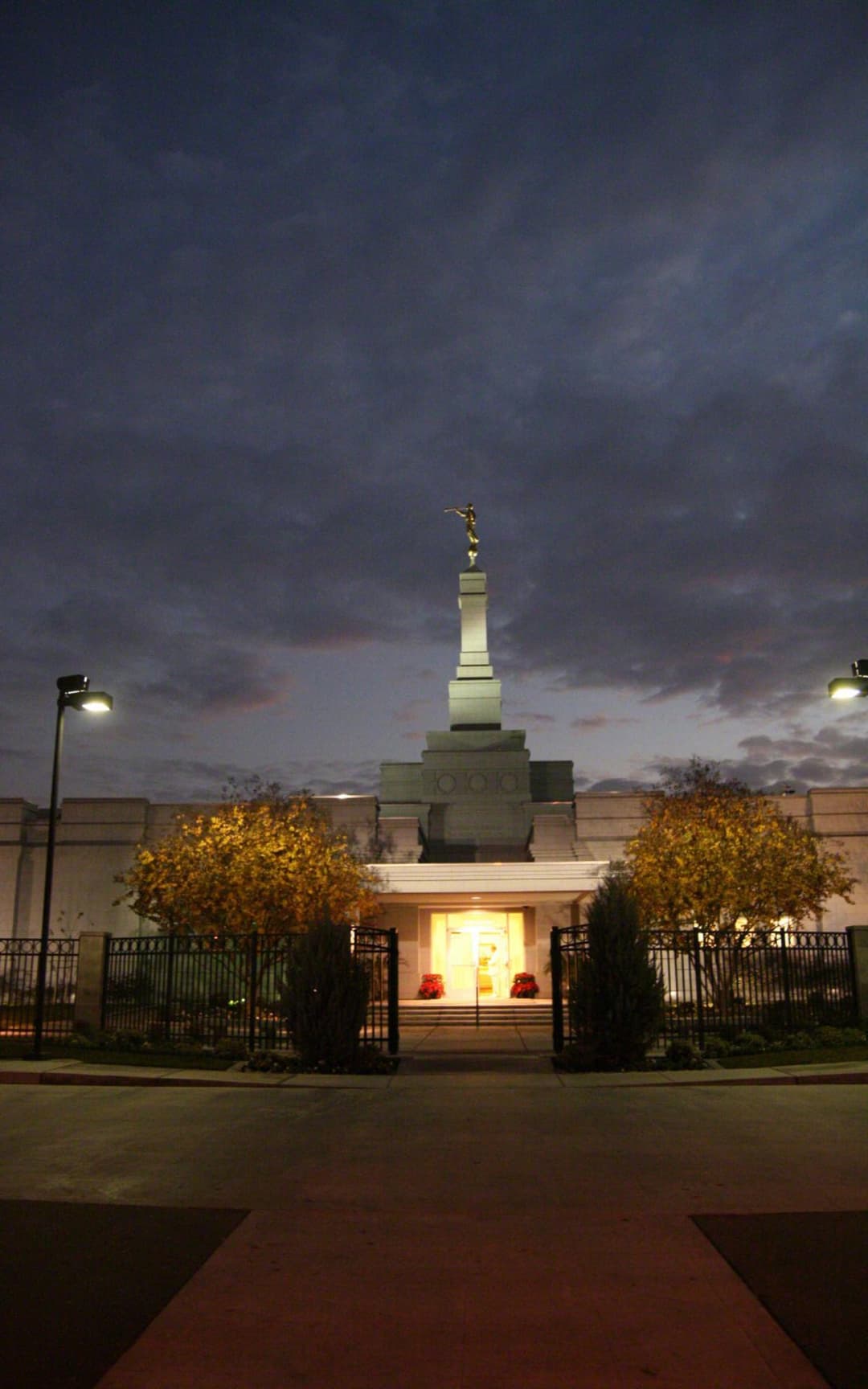 Fresno California Temple at twilight, front entrance with Angel Moroni spire.