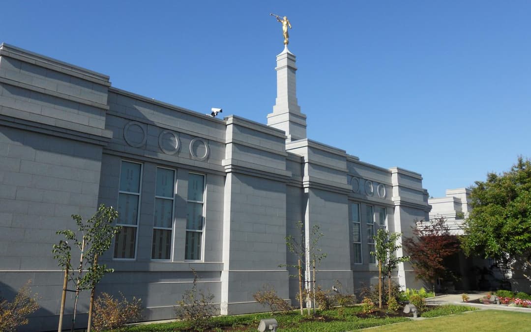 Fresno California Temple exterior, Angel Moroni statue, blue sky.