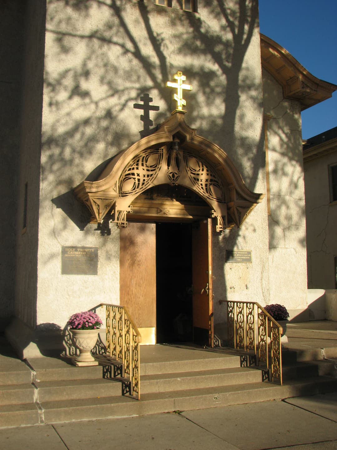 Front entrance canopy topped with a gilded Orthodox cross