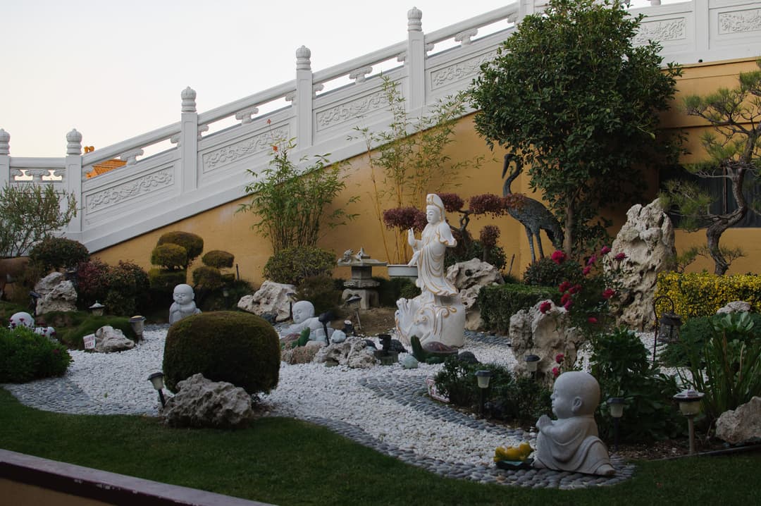 Landscaped garden with Guanyin and monk statues at Hsi Lai Temple.