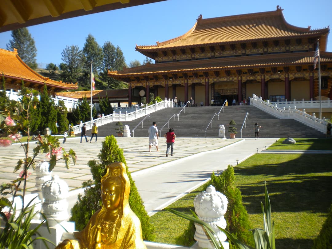 View of the Main Shrine Hall and grand courtyard in bright daytime light.