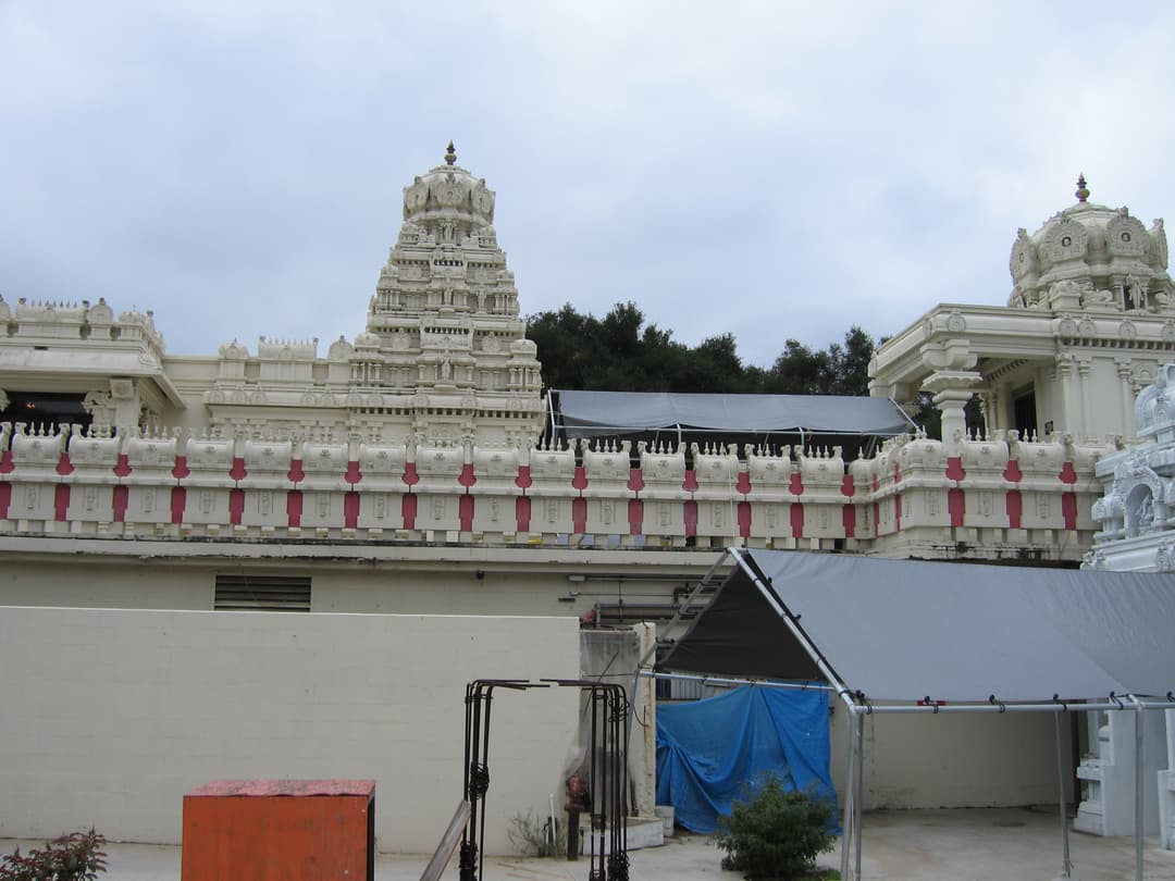 Dravidian vimana tower and parapet wall viewed from the courtyard