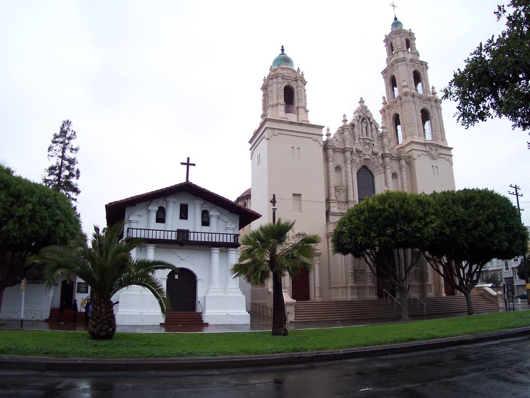 Front wide-angle view of Mission Dolores chapel and adjacent basilica.
