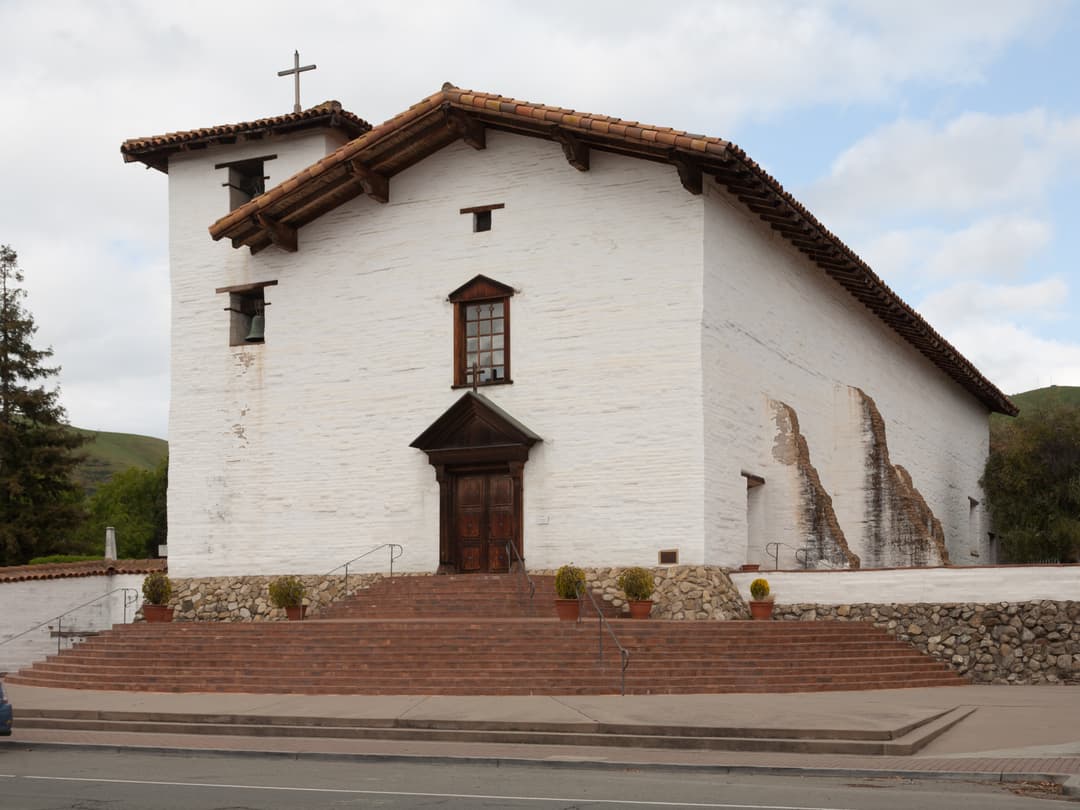 Front facade and entrance steps of Mission San José, exterior view.