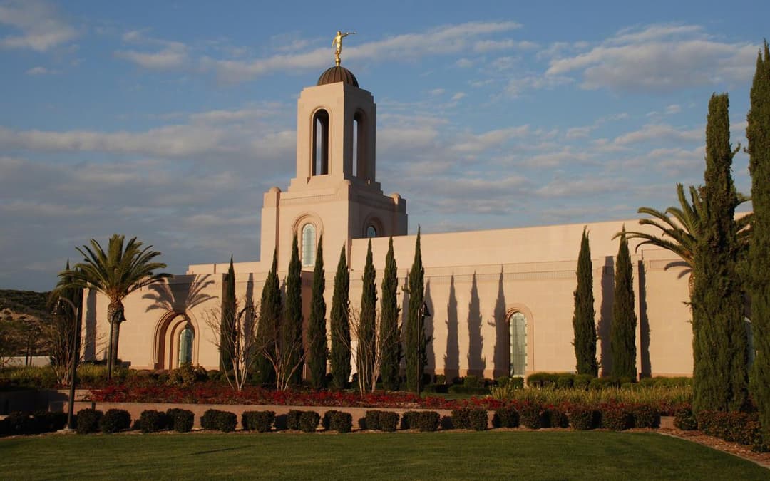 Newport Beach California Temple exterior, Angel Moroni, and long shadows.