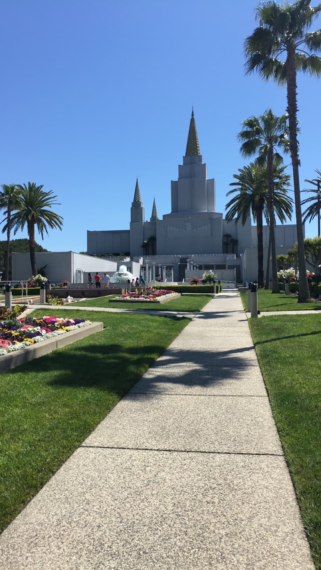 The temple's five spires reaching heavenward against a clear blue sky.