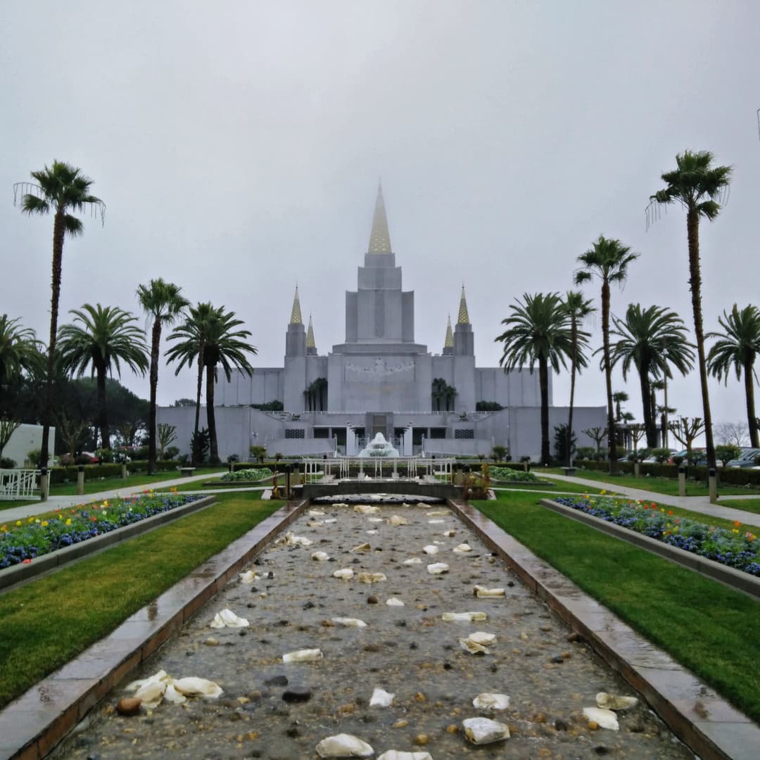 Reflecting pool and water feature leading to the temple entrance.