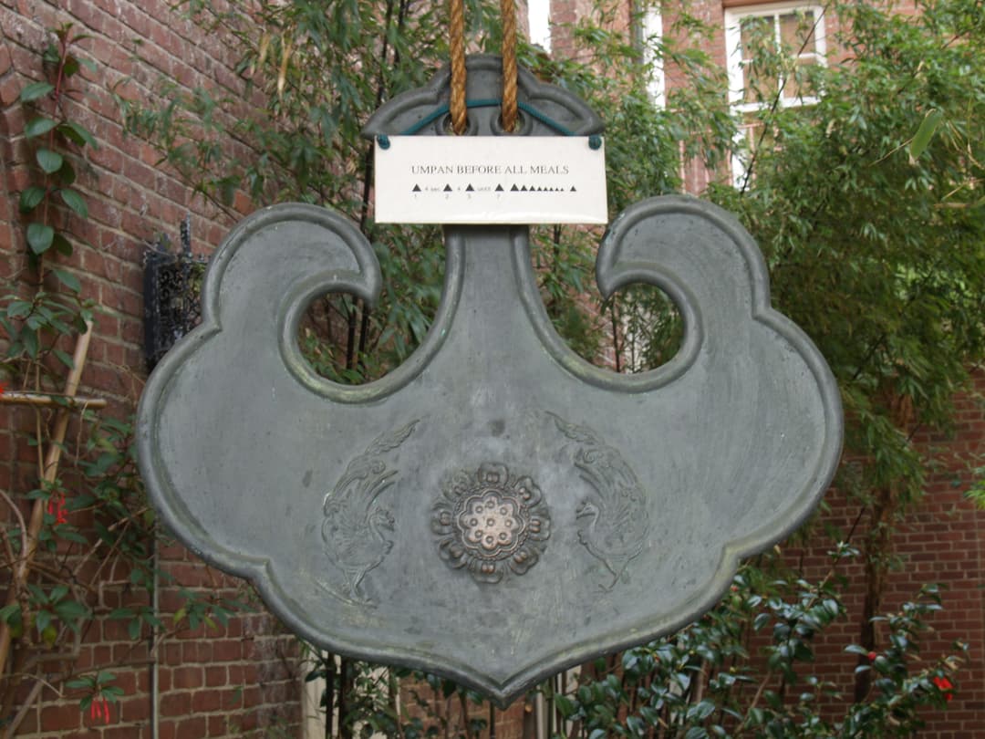 Bronze umpan (cloud gong) in the courtyard garden