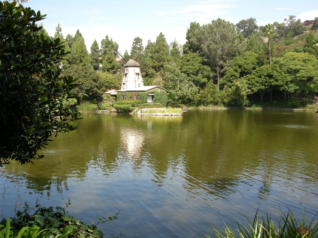 Wide view across the lake toward the historic windmill chapel.