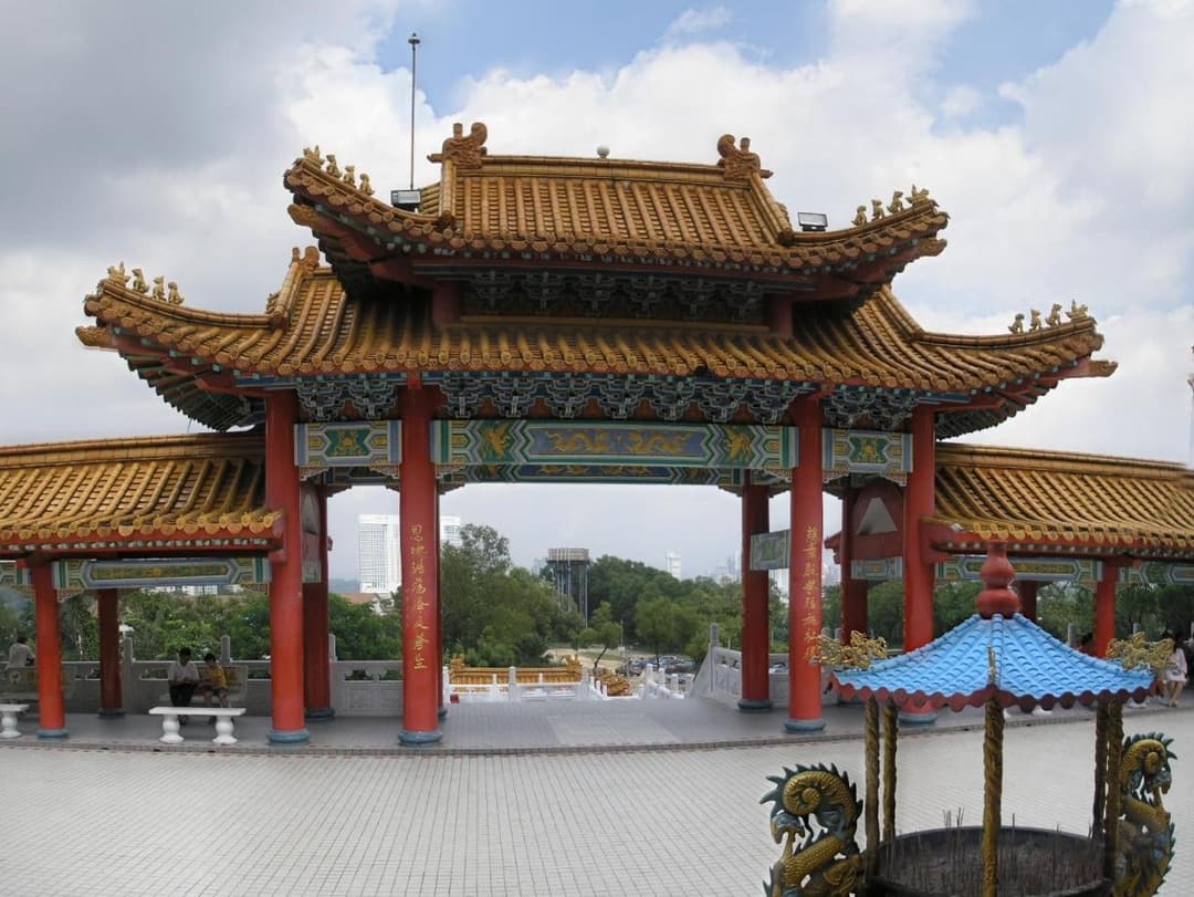 Wide view of the ornamental Chinese gateway and courtyard.