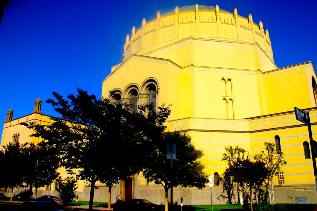 Sunlit exterior view of the Byzantine Revival dome and facade