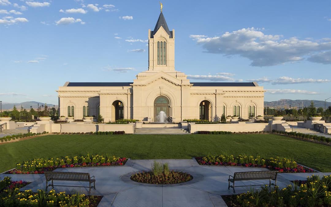 Fort Collins Colorado Temple: Front exterior with spire, fountain, and gardens.