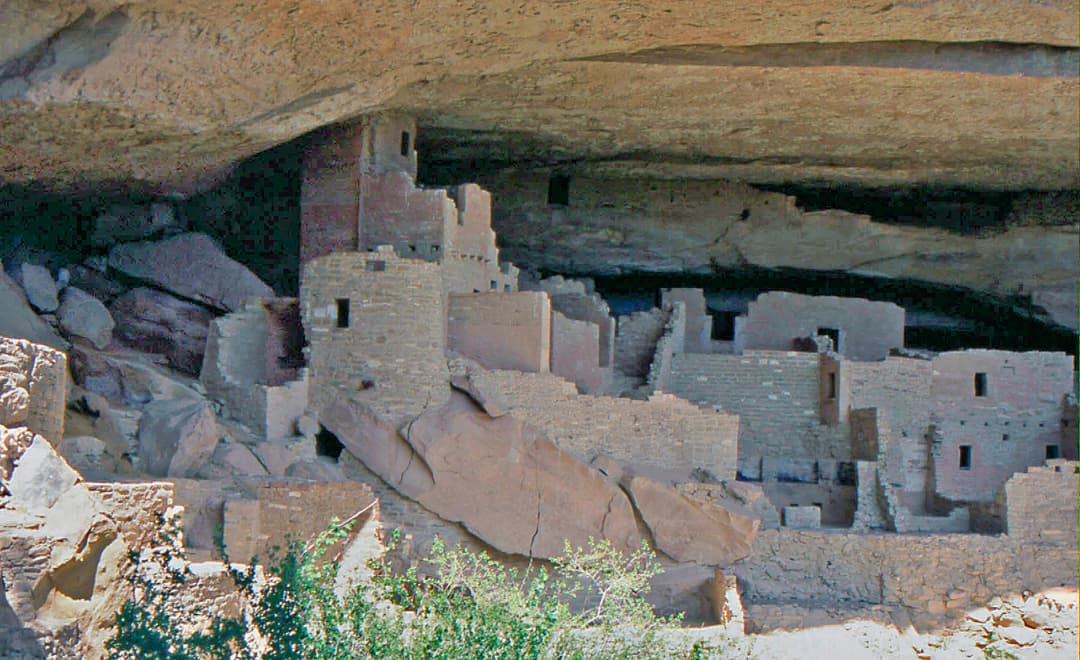 Central square and round towers of Cliff Palace inside the sandstone alcove.