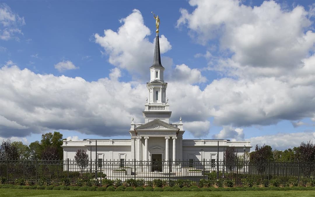 Daytime front exterior of Hartford CT Temple with spire and Angel Moroni.