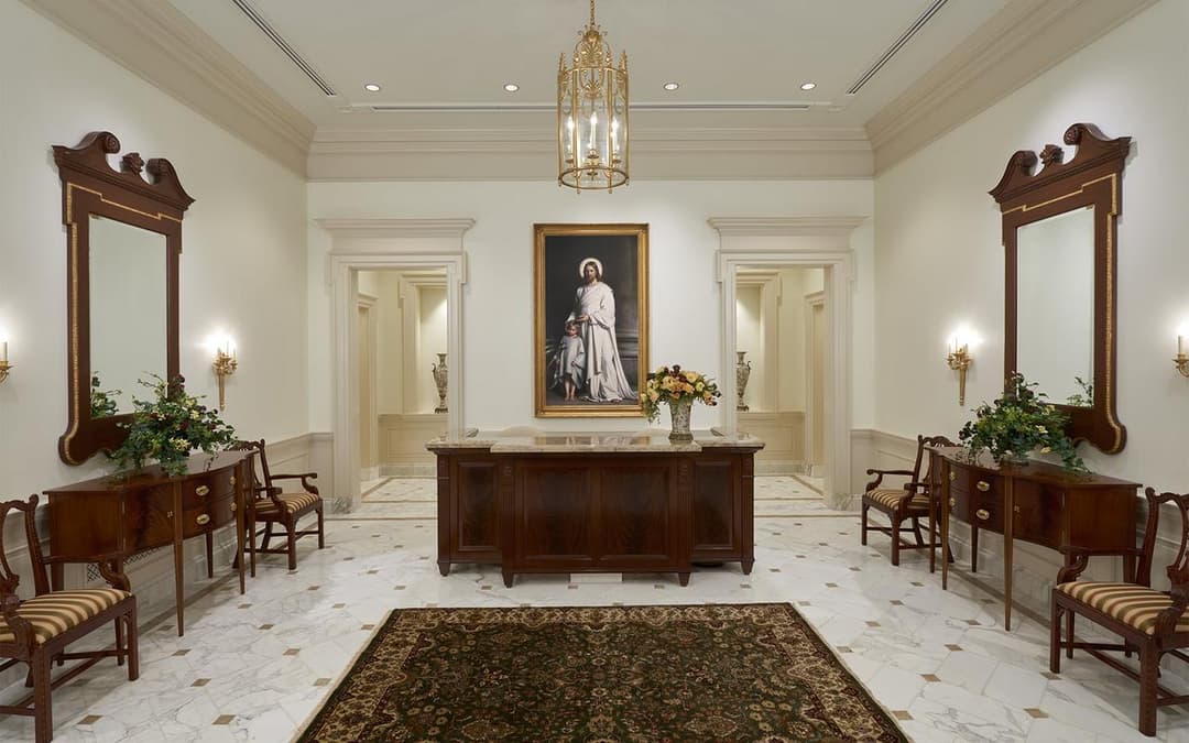 Interior view of Hartford CT Temple with painting of Christ, chandelier, and mirrors.