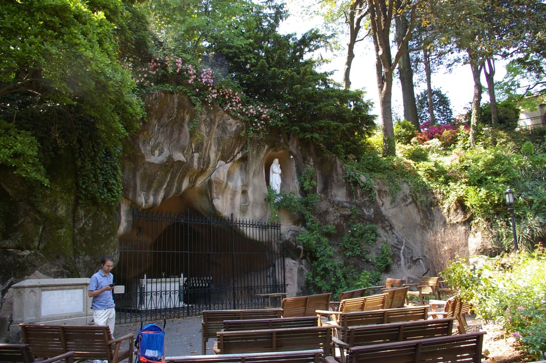 Replica of the Grotto of Lourdes in the outdoor monastery gardens.