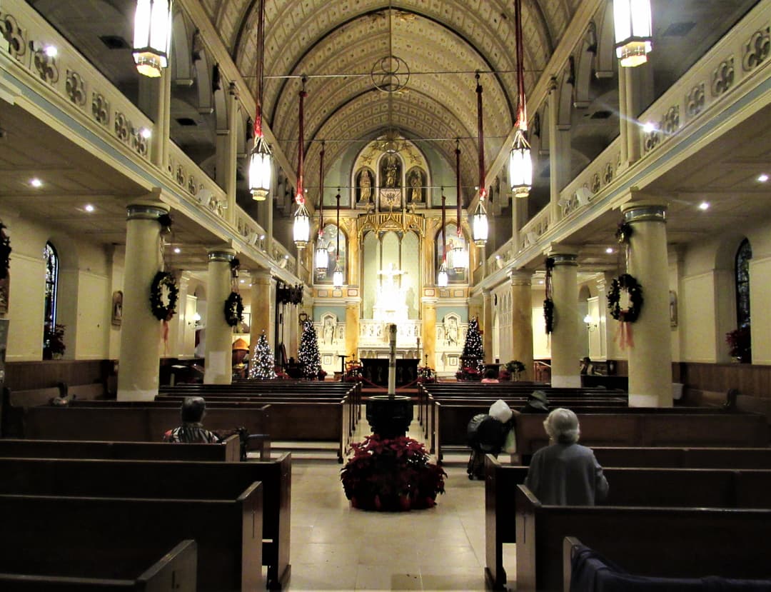Interior view of the nave and sanctuary decorated for Christmas