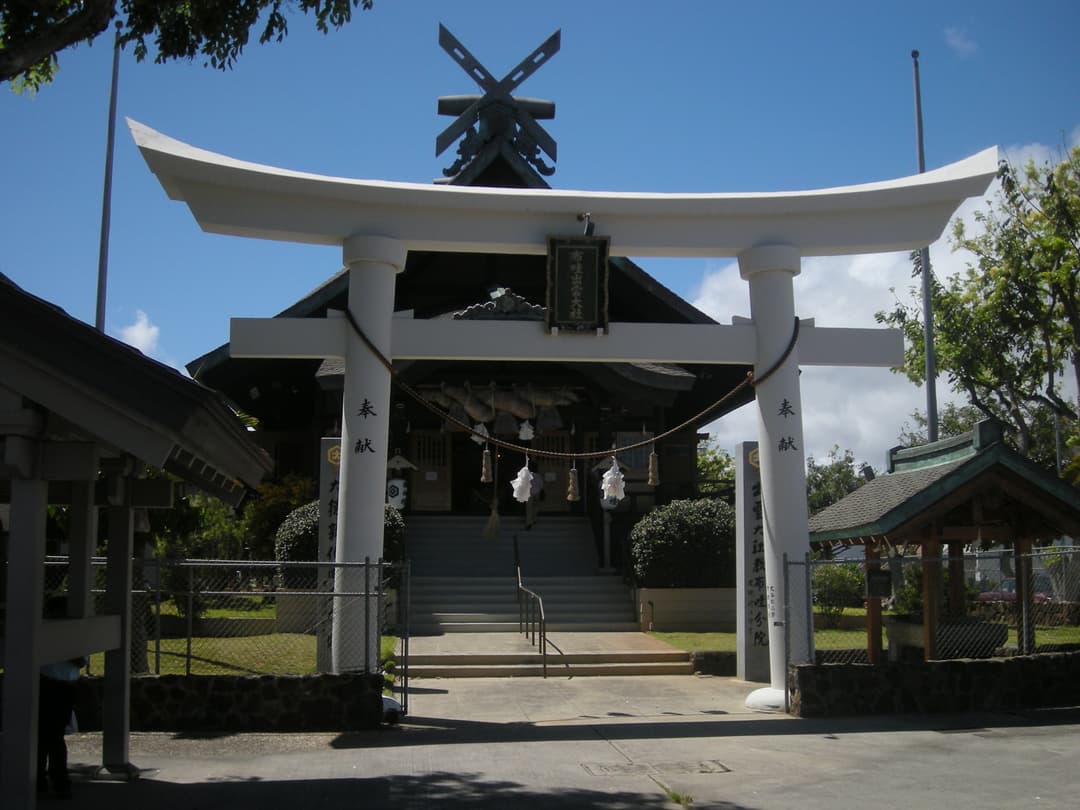 Front view of the sanctuary framed by the white torii gate
