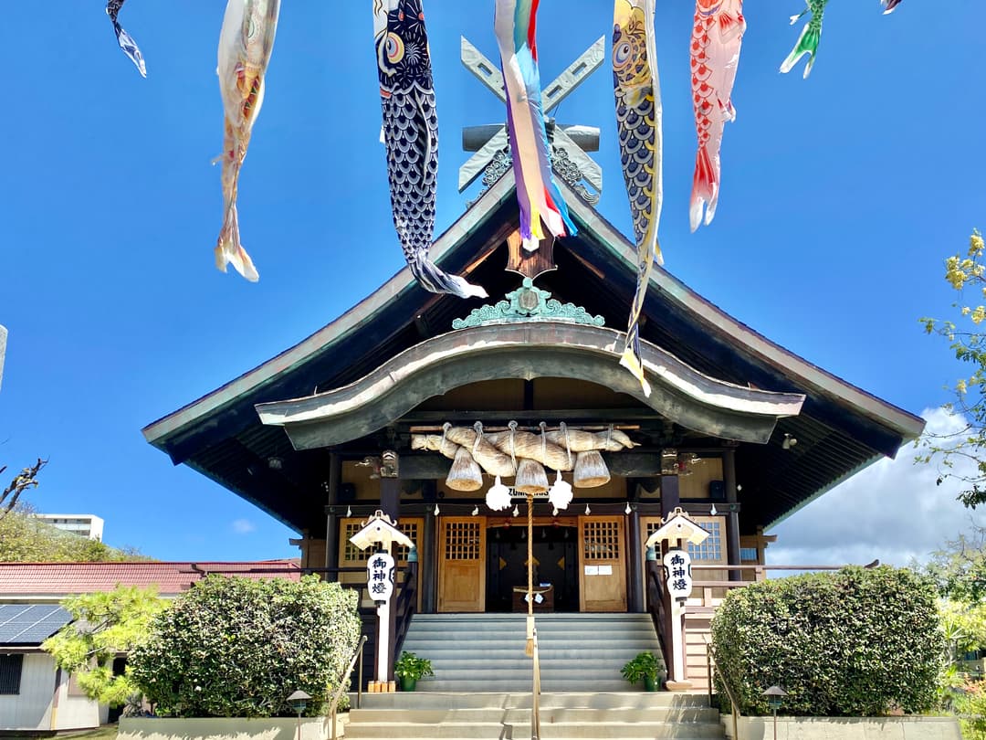 Main sanctuary front entrance framed by hanging koinobori streamers