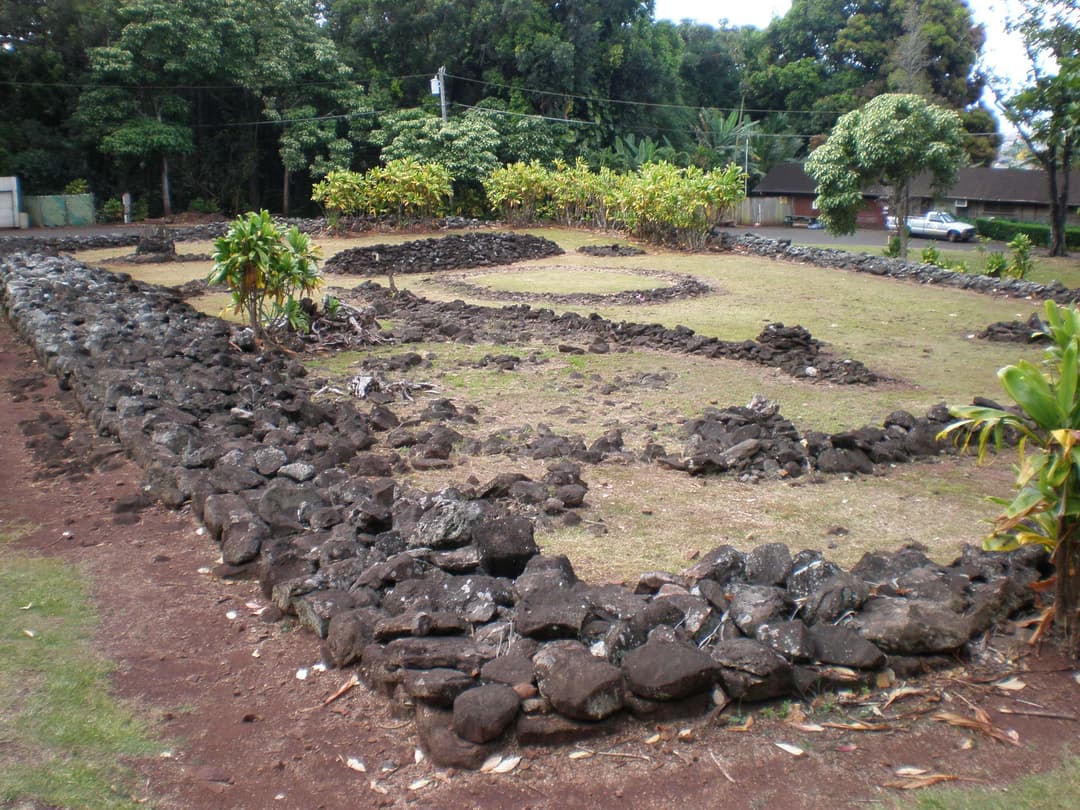 Elevated view of the dry-stacked basalt stone enclosure at Keaʻiwa Heiau.