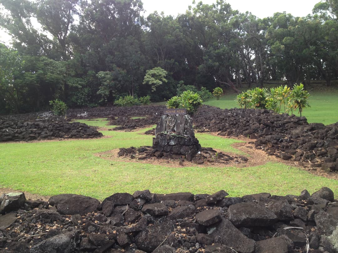 Ground-level view of the dry-stacked basalt stone enclosure at Keaʻiwa Heiau.