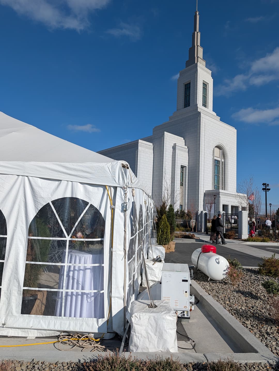 Daytime view of the Burley Idaho Temple behind a white event tent.
