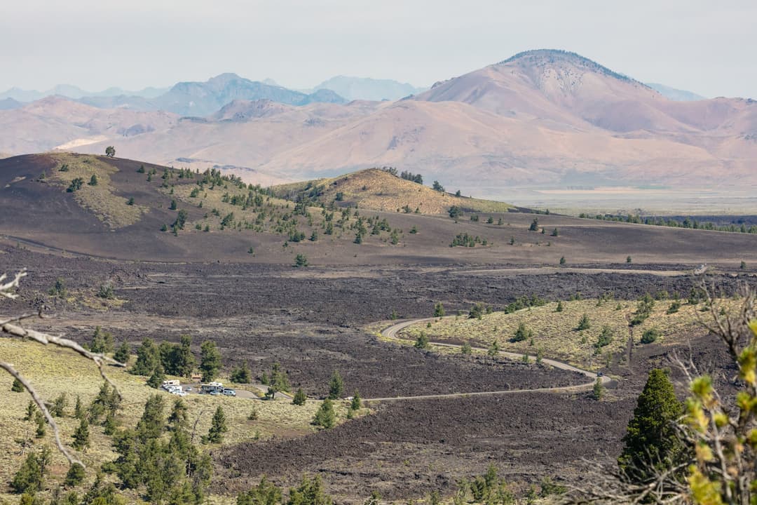 Elevated view of the loop road winding through cinder cones and lava fields.