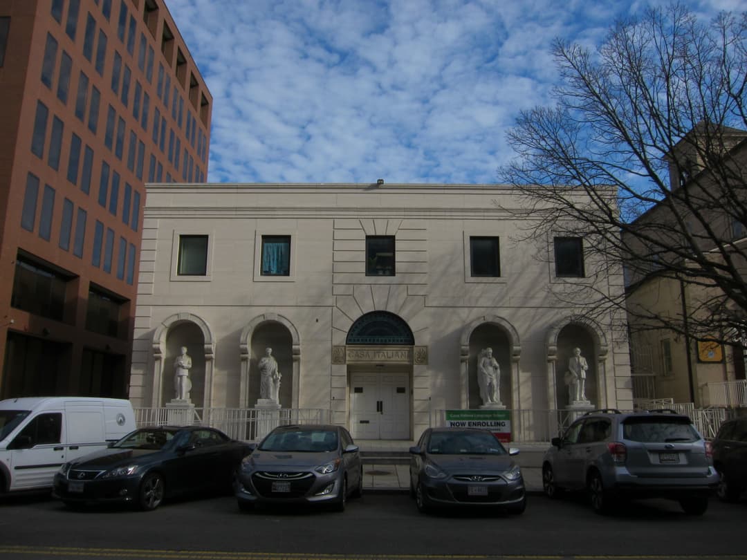 Front view of Casa Italiana with statues in arched exterior niches.