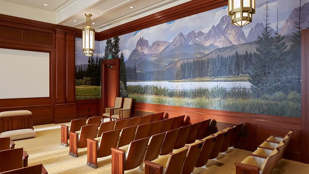 Interior of Meridian Idaho Temple with mountain mural and seating.