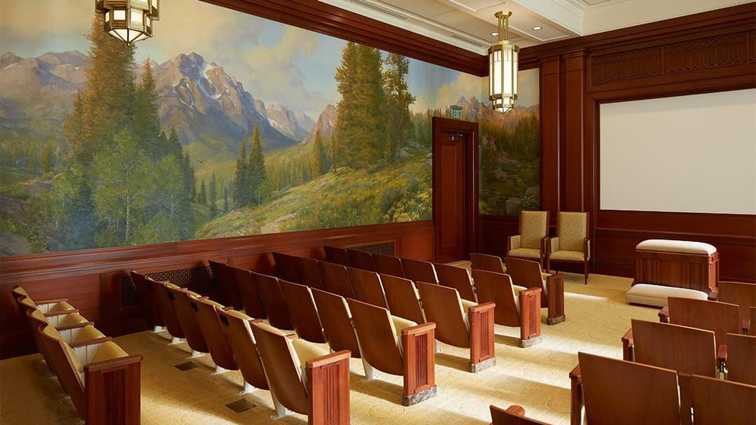 Interior of Meridian Idaho Temple with mountain mural and seating.