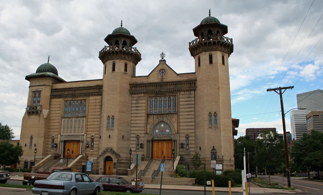 Exterior view of the front facade and twin domed towers