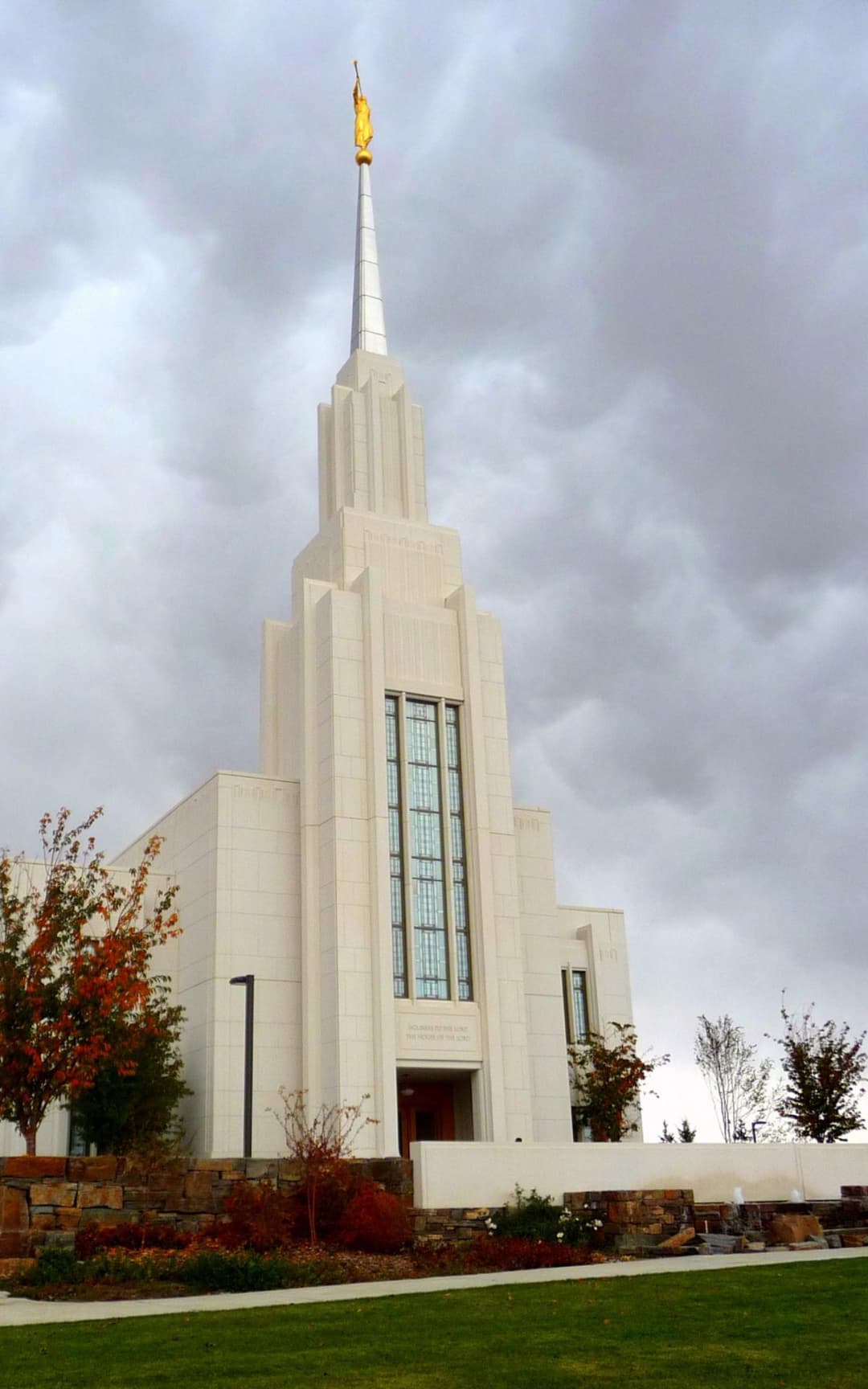 Low-angle view of the Twin Falls Idaho Temple entrance and spire.