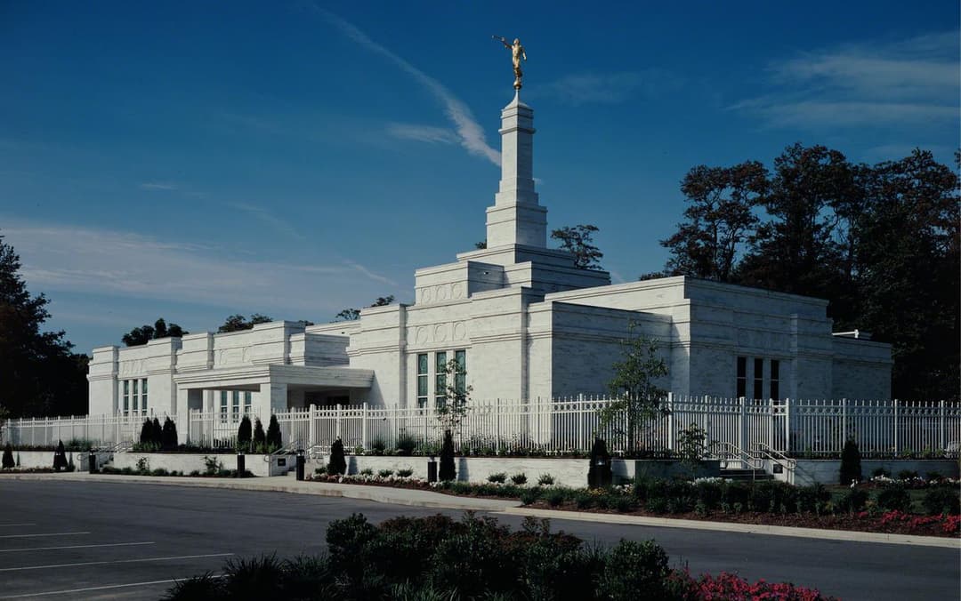 Exterior view of the Louisville Kentucky Temple and spire on a clear day