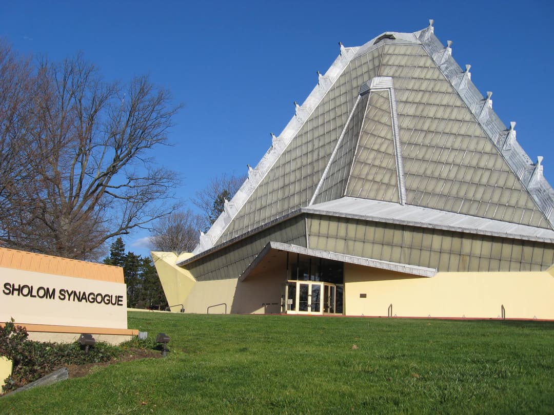 Exterior view of the entrance and translucent pyramidal tower