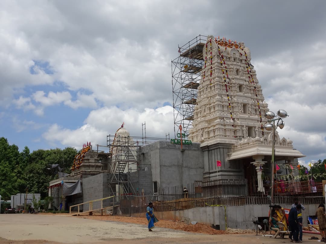 Exterior view of the rajagopuram and temple complex under construction.