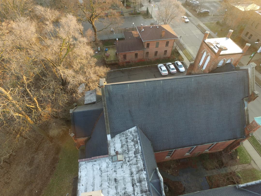Overhead view of the church roof and grounds in late afternoon light