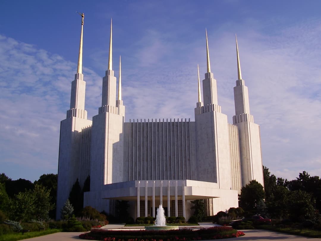 Washington D.C. Temple, front view with six spires, Angel Moroni, and fountain.