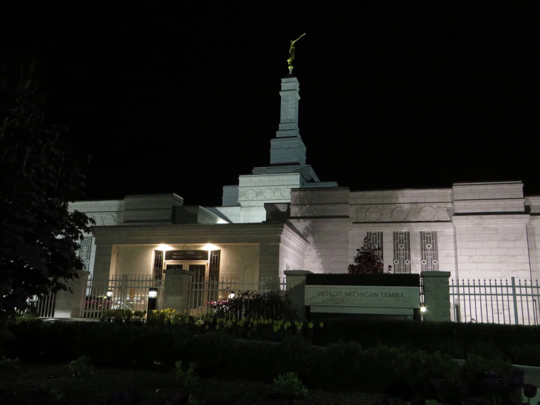 Detroit Michigan Temple at night, with Angel Moroni and front entrance.