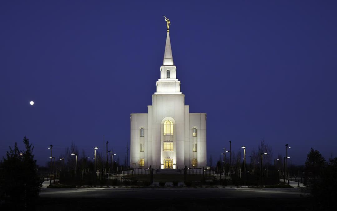 Kansas City Missouri Temple at night, front view, Moroni statue, moon.