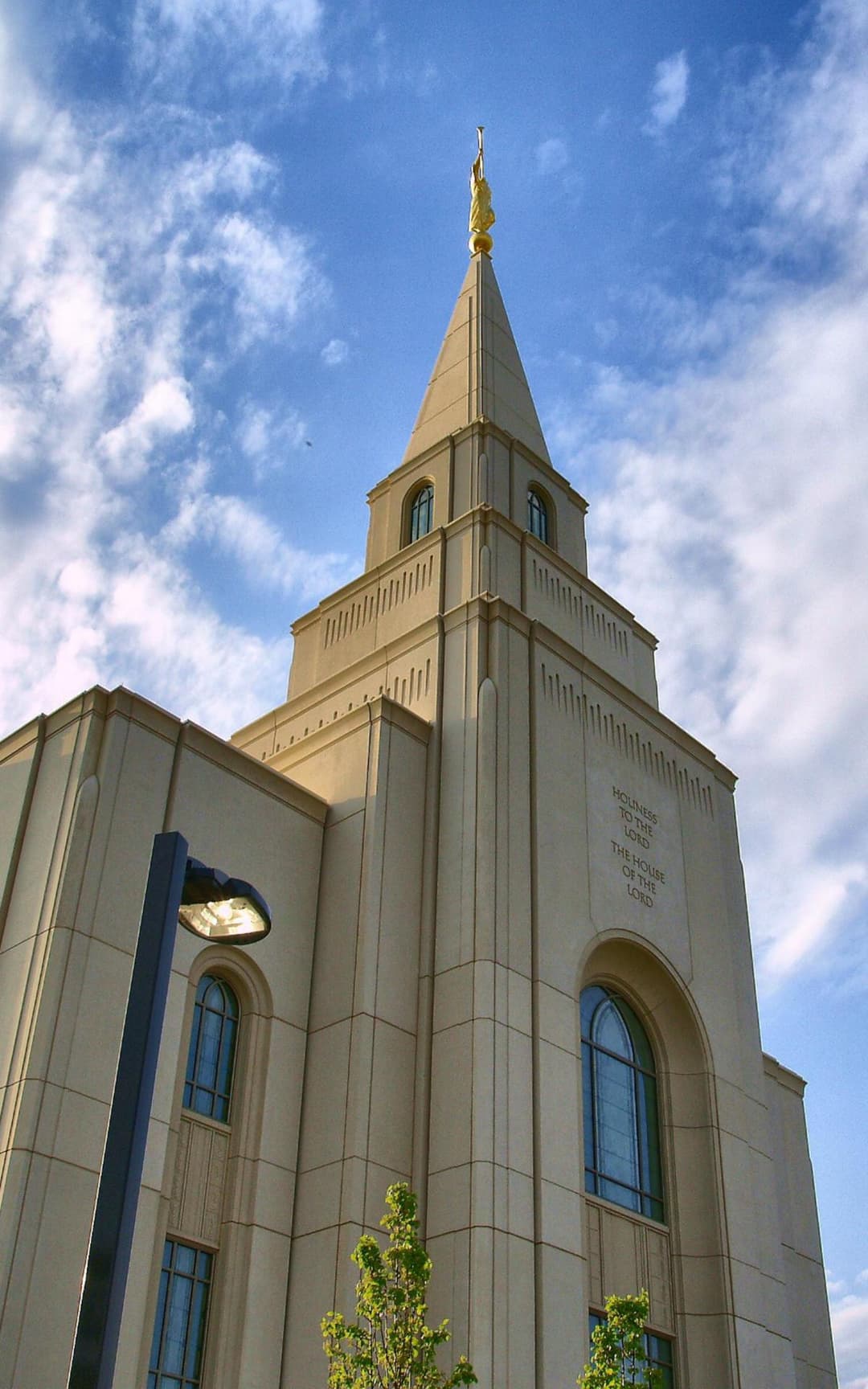 Kansas City Missouri Temple spire, Angel Moroni, and inscription, low angle.