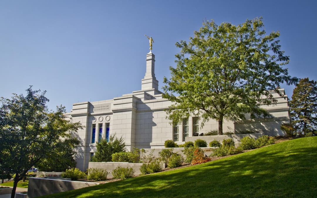 Exterior view of the Winter Quarters Nebraska Temple atop a grassy hill.