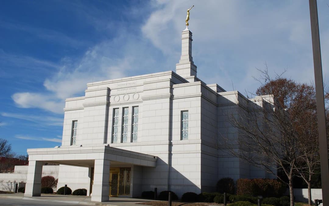 Exterior view of the Winter Quarters Nebraska Temple entrance and spire.