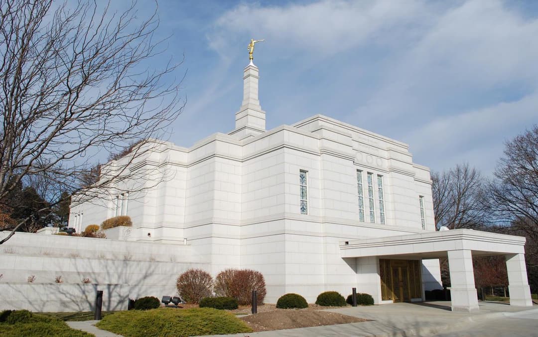 Exterior view of the Winter Quarters Nebraska Temple entrance and spire.