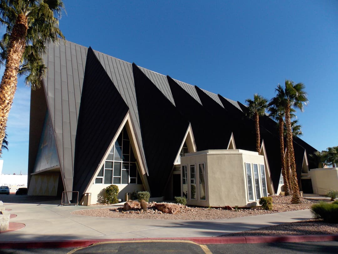 Exterior view of Guardian Angel Cathedral's geometric A-frame roofline.
