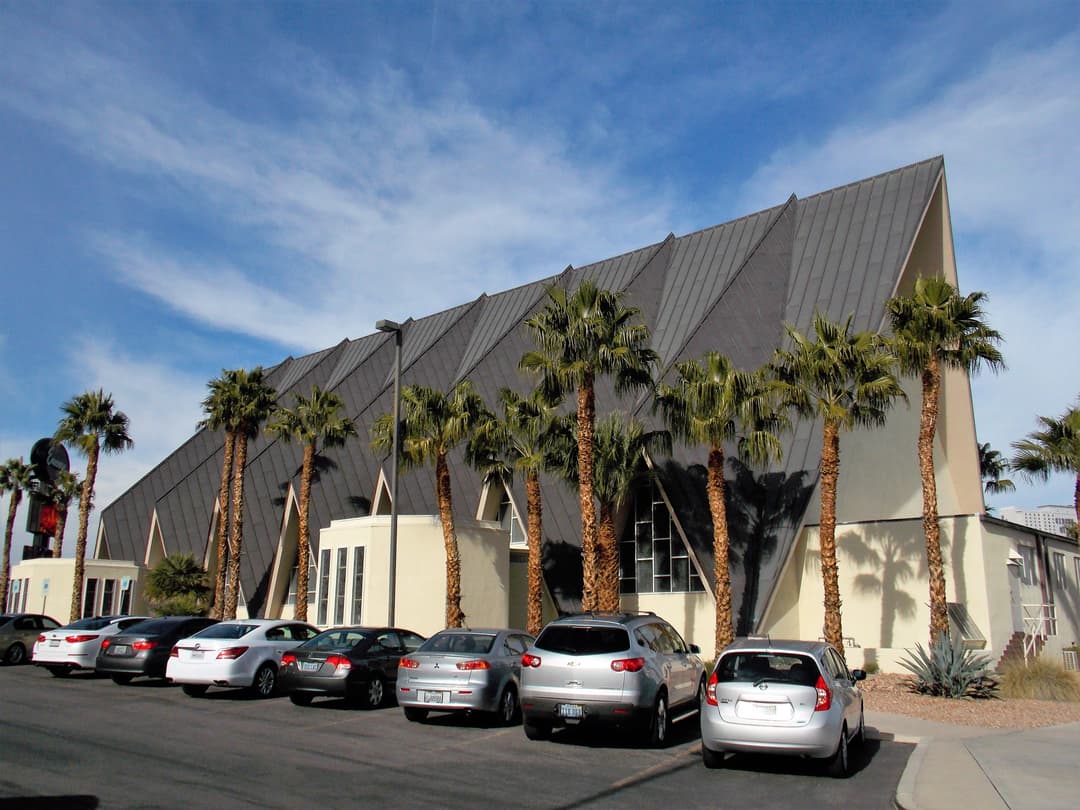 Exterior side view of Guardian Angel Cathedral showing its folded-plate roof.
