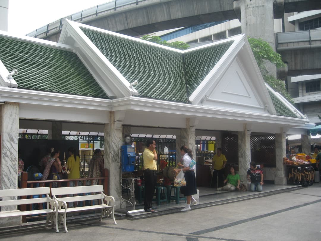 Open-air Thai pavilion with green-tiled roof on the shrine grounds