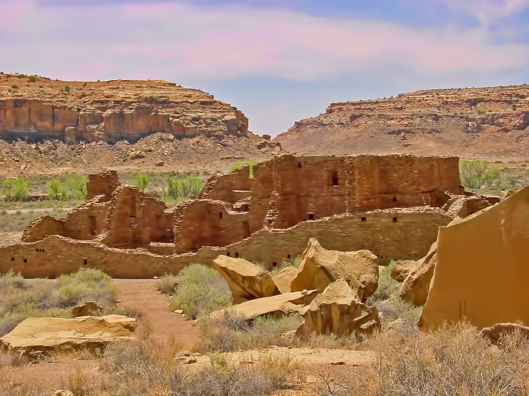 Ground-level view of the sandstone ruins of Pueblo Bonito and rockfall.